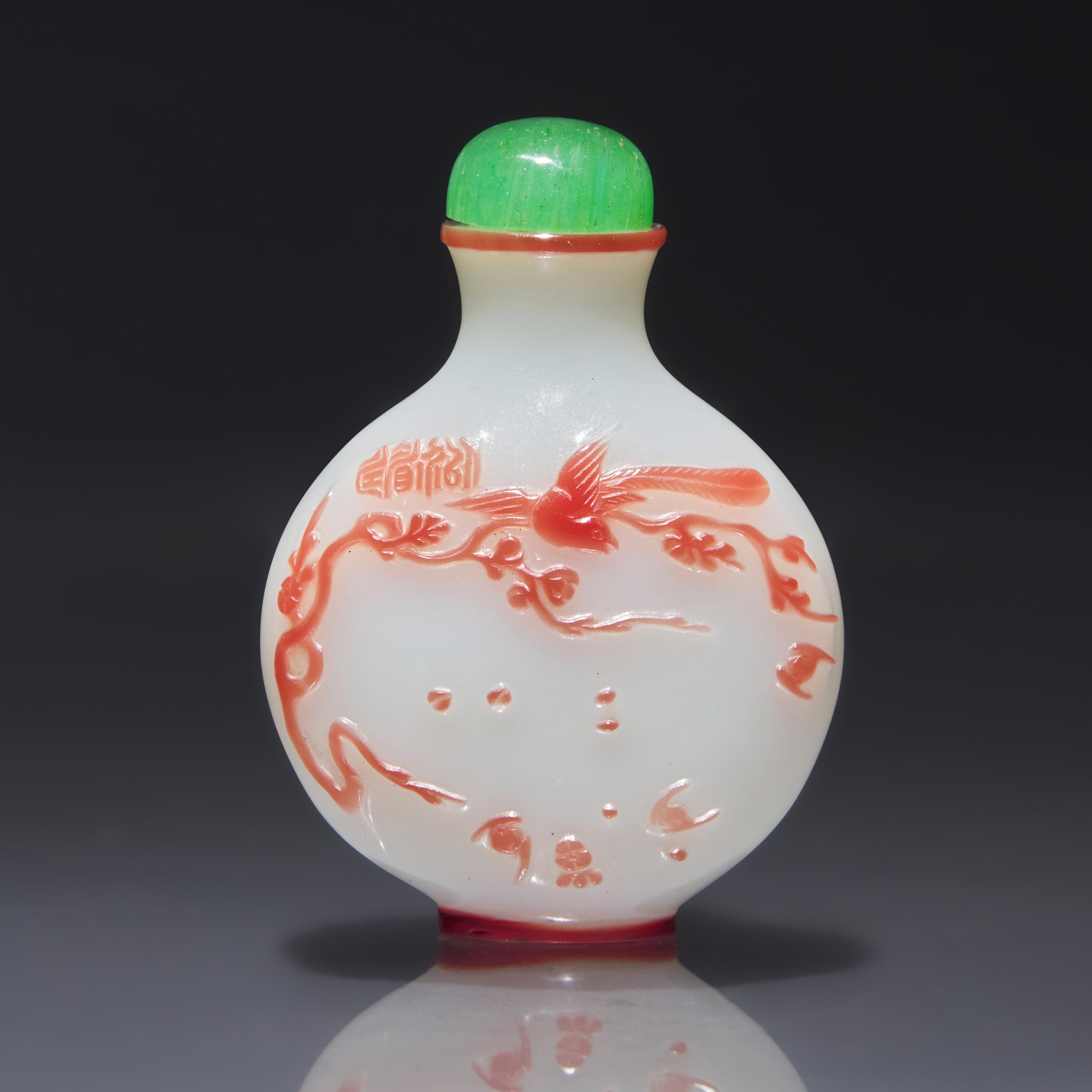 A Chinese Overlay Glass Snuff Bottle, Yangzhou School, Qing Dynasty, Circa 1850-1890 — 1850-1890年 揚州作涅白地套粉紅料以介眉壽鼻煙壺