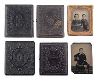 [EARLY PHOTOGRAPHY]. A group of 19 ambrotypes and tintypes of children of varying ages, some posed with their parents, incl. African American infant and pairs of images taken during the same sitting.