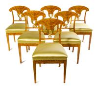 A Set of Six Biedermeier Parcel Gilt Satinwood Side Chairs Height 33 3/4 inches. — CIRCA 1815