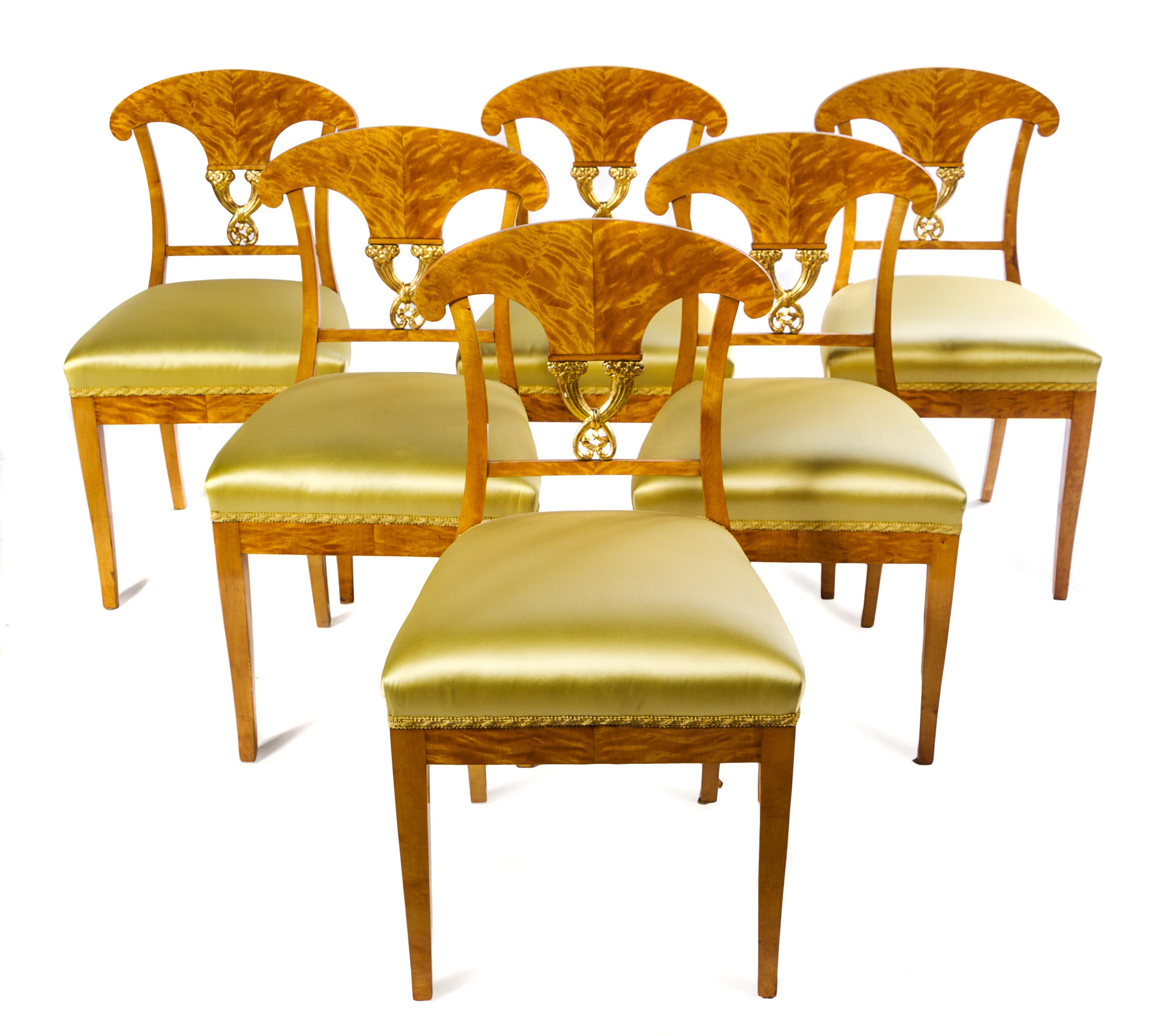 A Set of Six Biedermeier Parcel Gilt Satinwood Side Chairs Height 33 3/4 inches. — CIRCA 1815