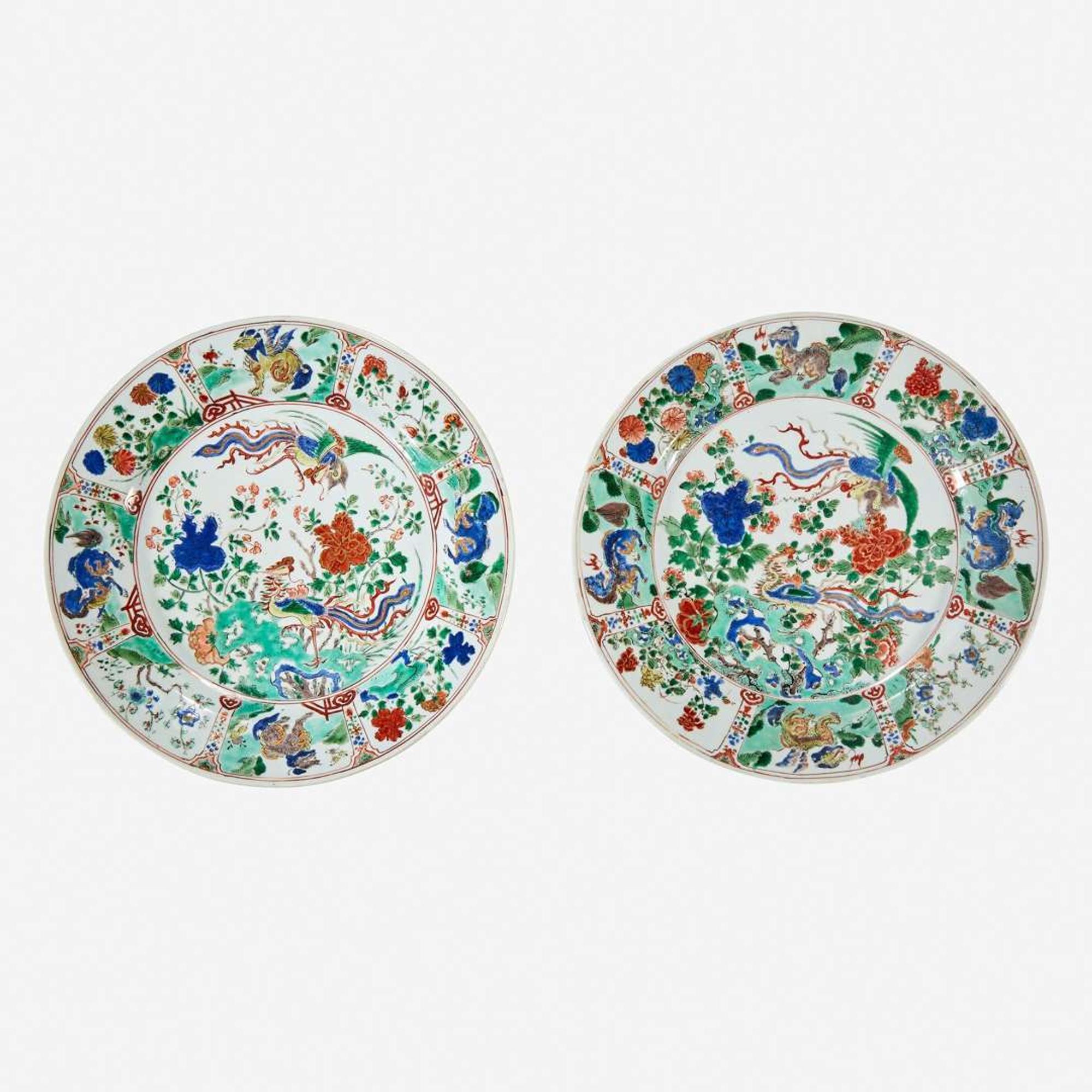 Two similar Chinese famille verte-decorated porcelain “Phoenix and Peony” dishes Kangxi six-character marks and of the period