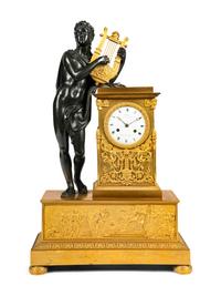 A Restauration Gilt and Patinated Bronze Mantel Clock with Orpheus and a Lyre