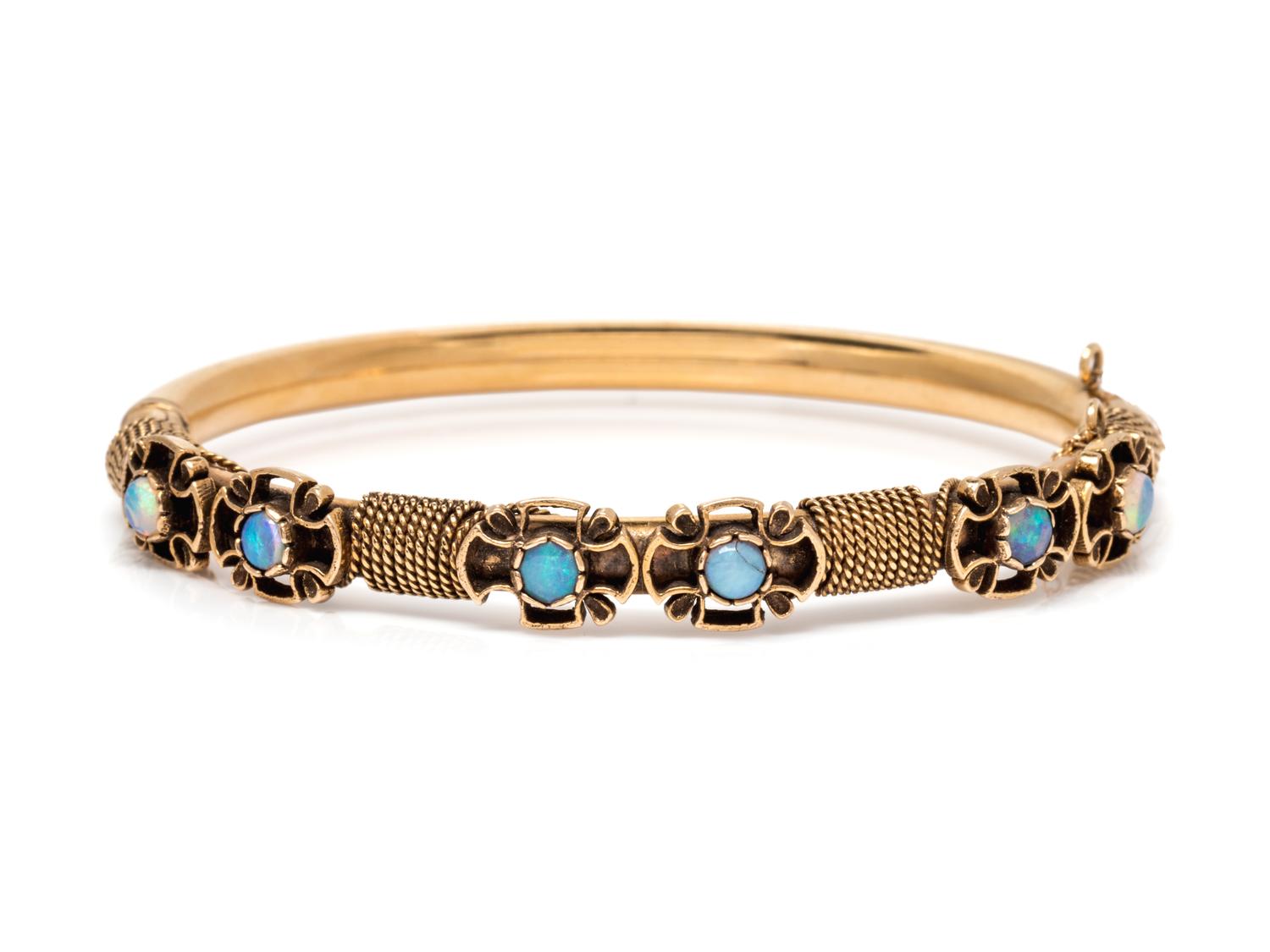 A 14 Karat Yellow Gold and Opal Bangle Bracelet,