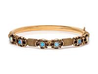 A 14 Karat Yellow Gold and Opal Bangle Bracelet,
