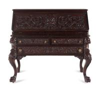 A Renaissance Revival Carved Mahogany Slant-Front Bureau