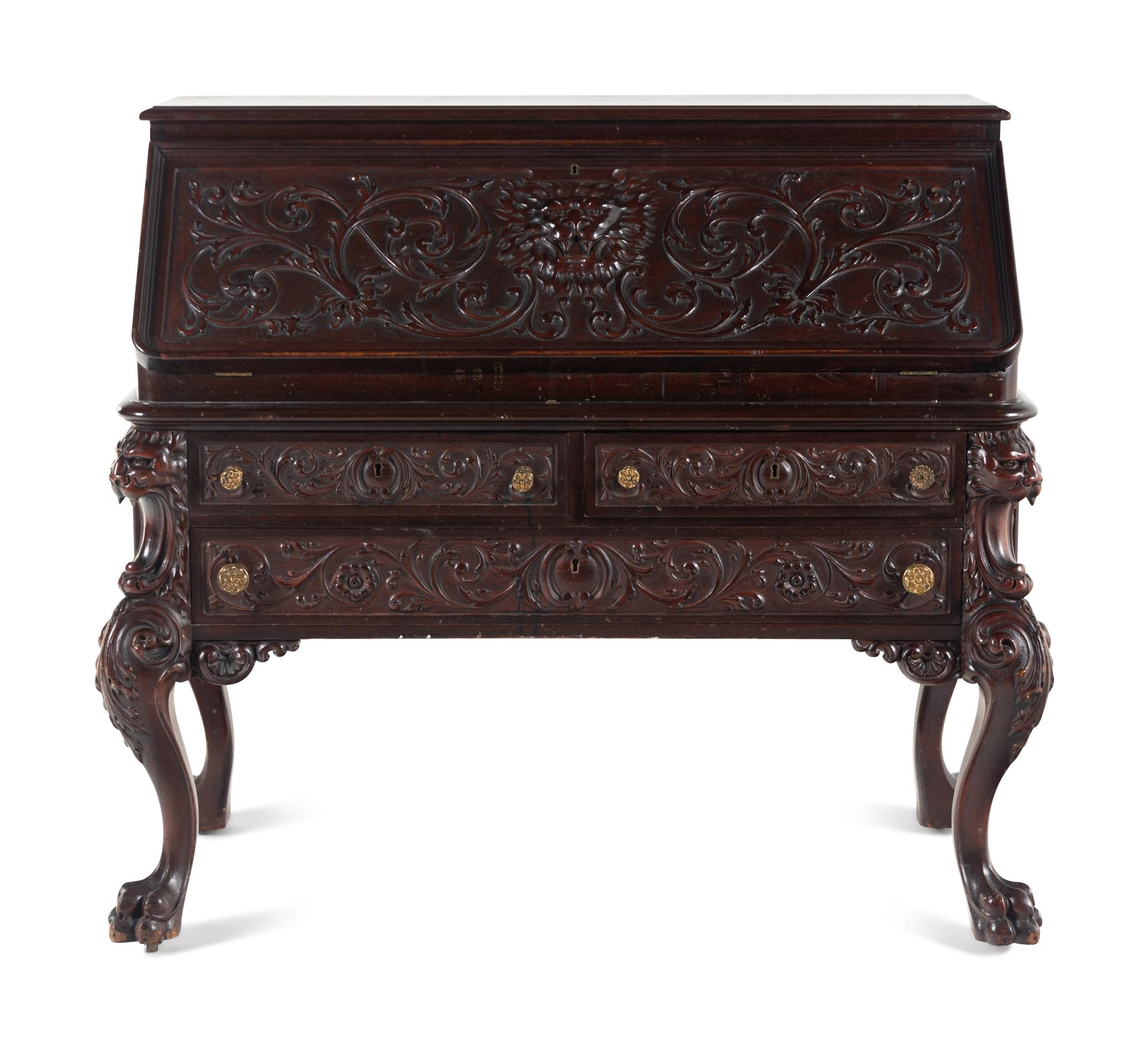 A Renaissance Revival Carved Mahogany Slant-Front Bureau
