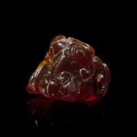 A Chinese Carved 'Bats and Shou-Lao' Amber Pendant, 18th-19th Century 清中期 五福捧壽琥珀把件