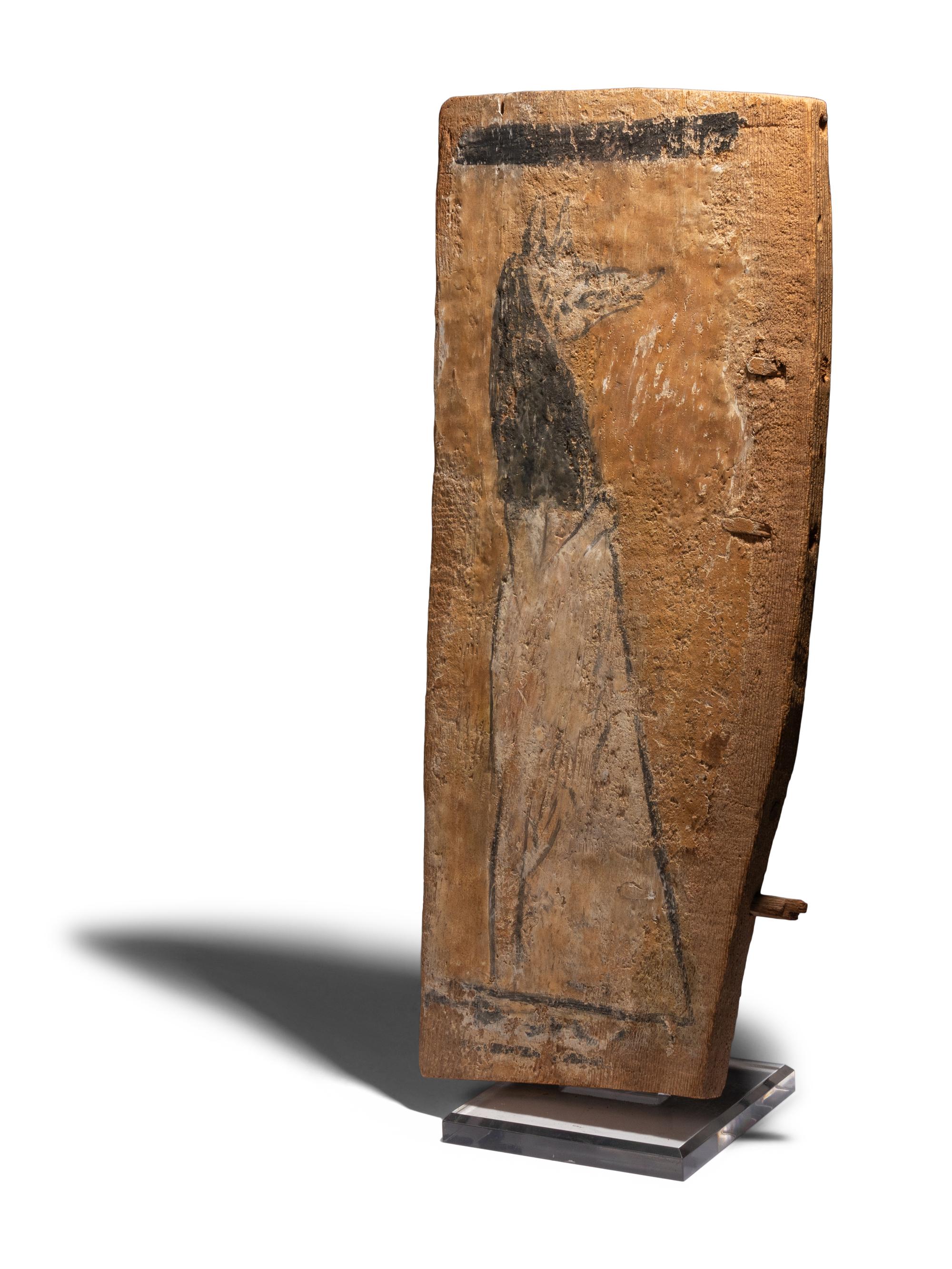 An Egyptian Painted Wood Sarcophagus Fragment with Anubis