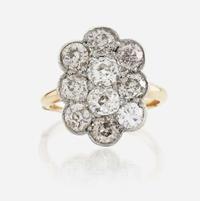 A diamond and platinum topped gold ring