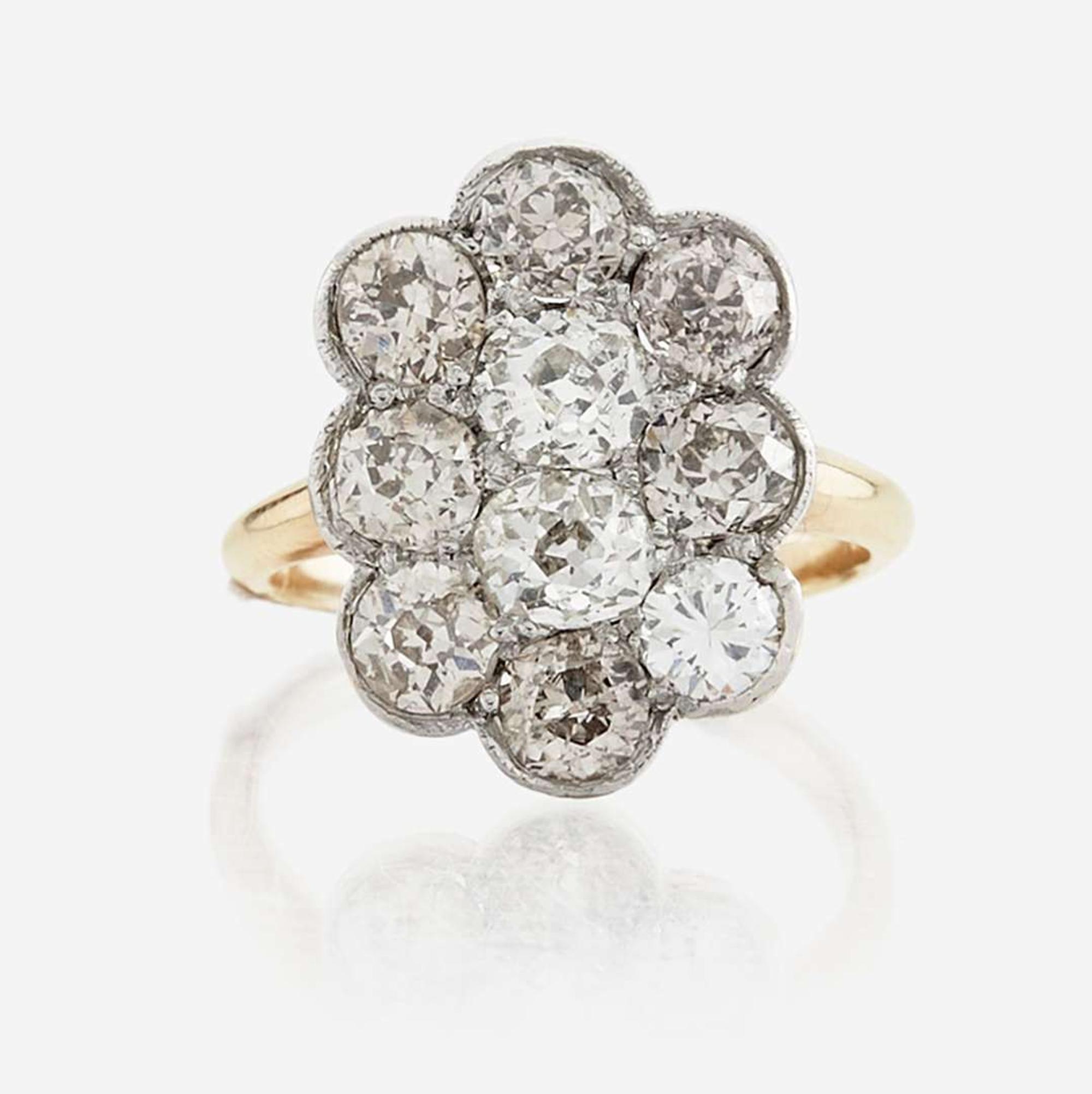 A diamond and platinum topped gold ring