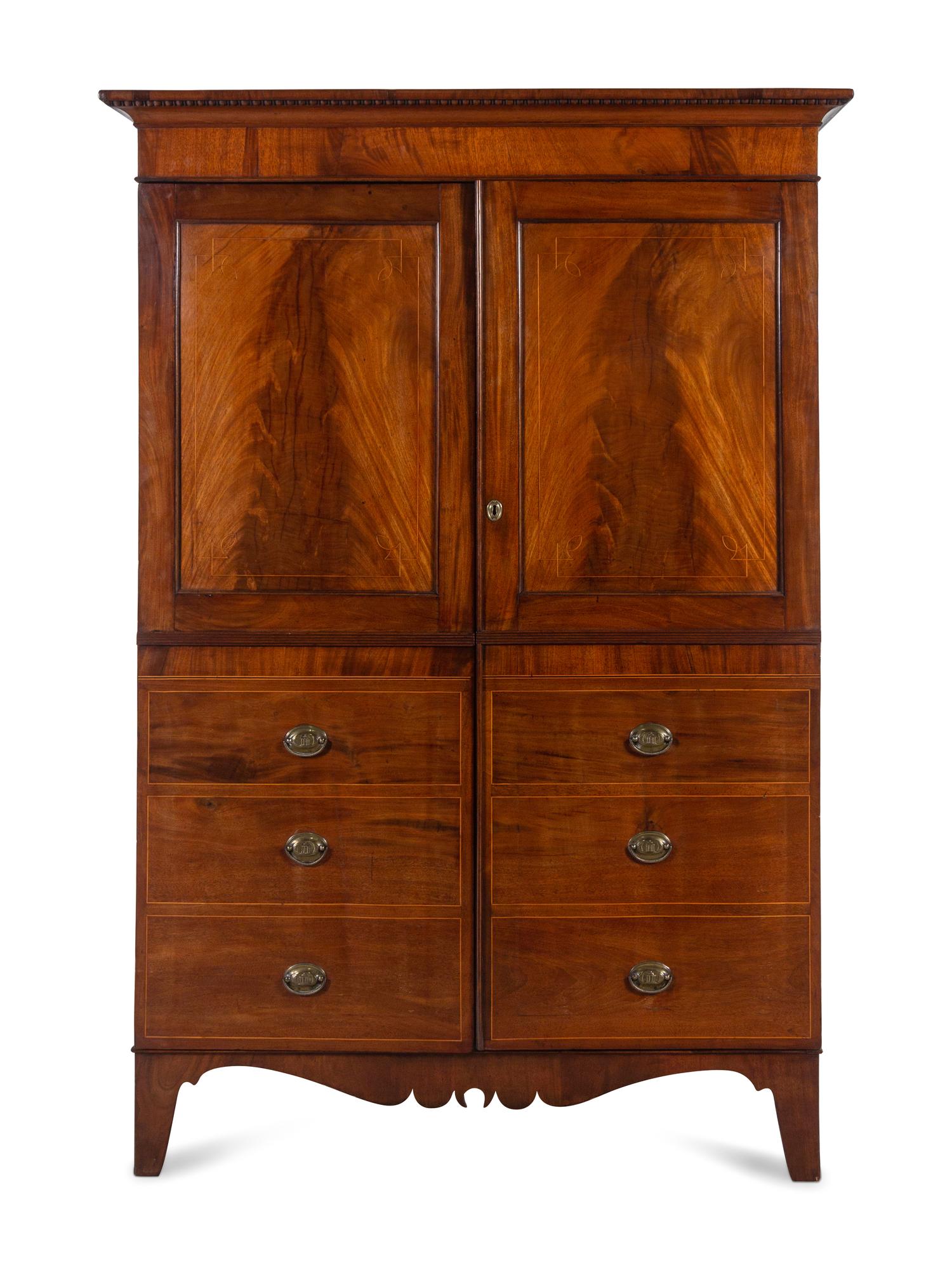 A Regency Mahogany Armoire Simulating a Linen Press
