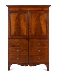 A Regency Mahogany Armoire Simulating a Linen Press