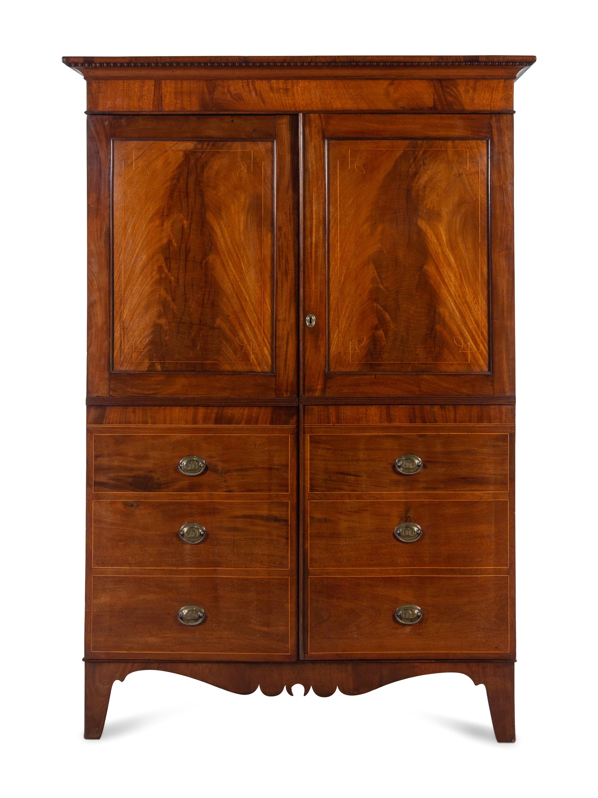 A Regency Mahogany Armoire Simulating a Linen Press
