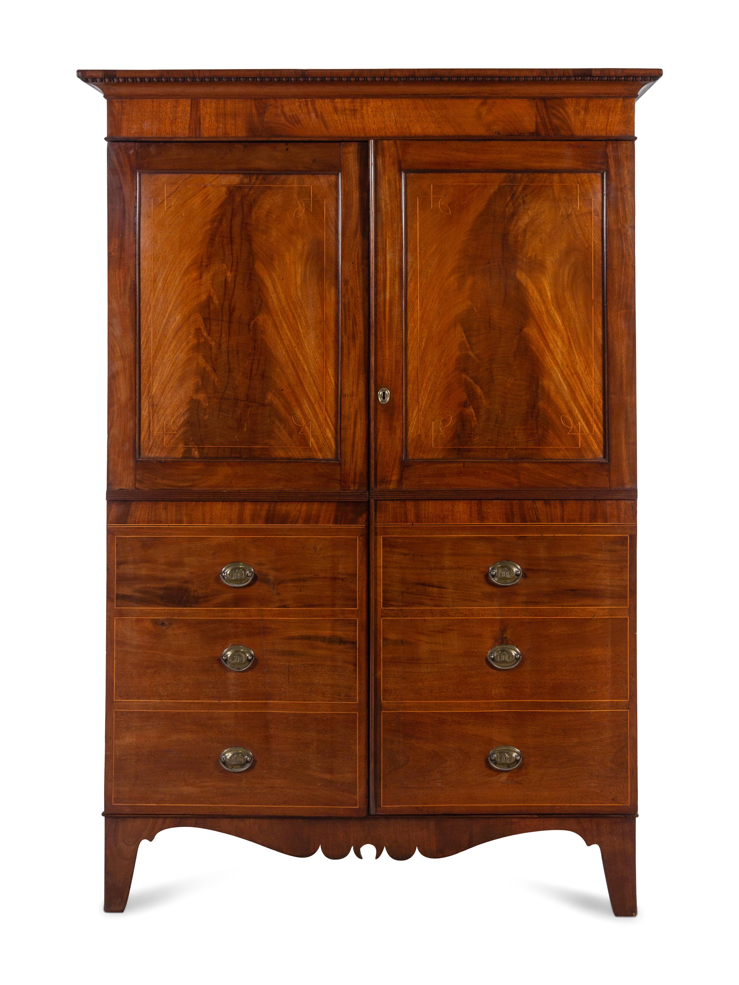 A Regency Mahogany Armoire Simulating a Linen Press