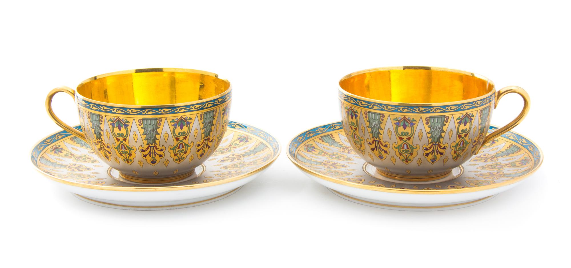 Two French Porcelain Cups and Saucers Diameter of saucers 7 1/4 inches.