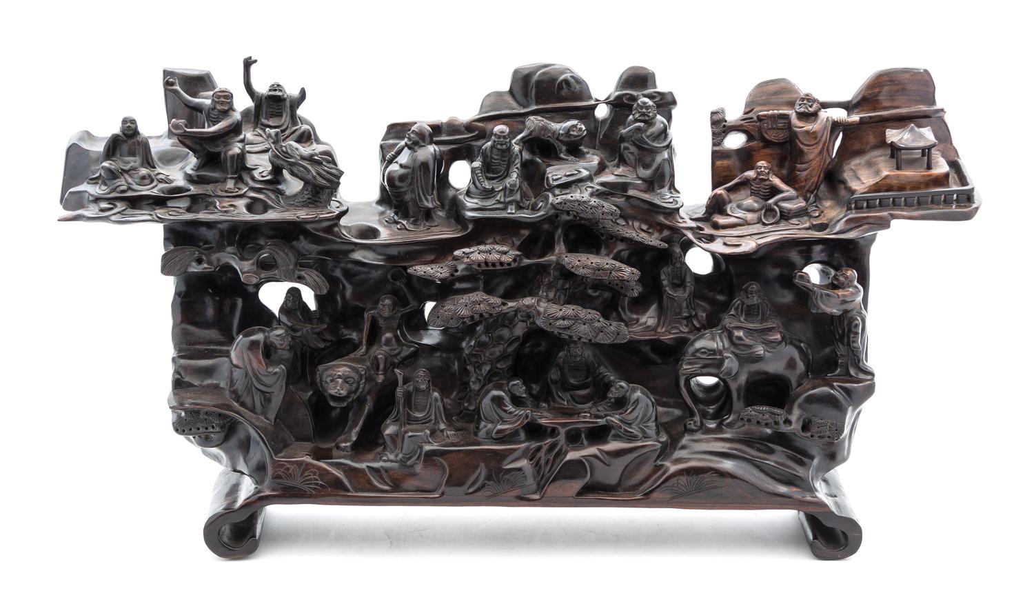 A Carved Zitan Figural Composition Width 25 inches.