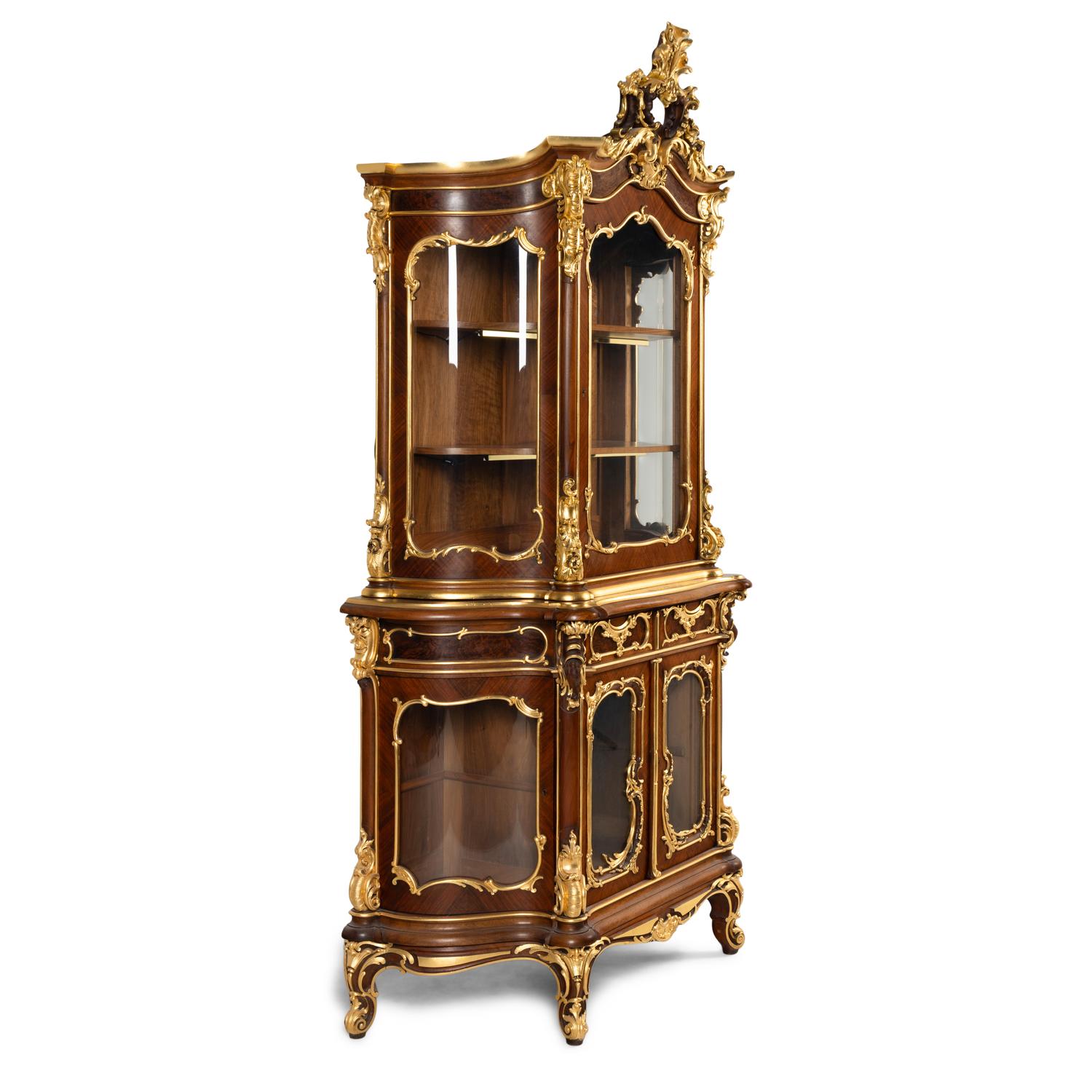 A Louis XV Style Parcel Gilt Mahogany Cabinet à Deux Corps