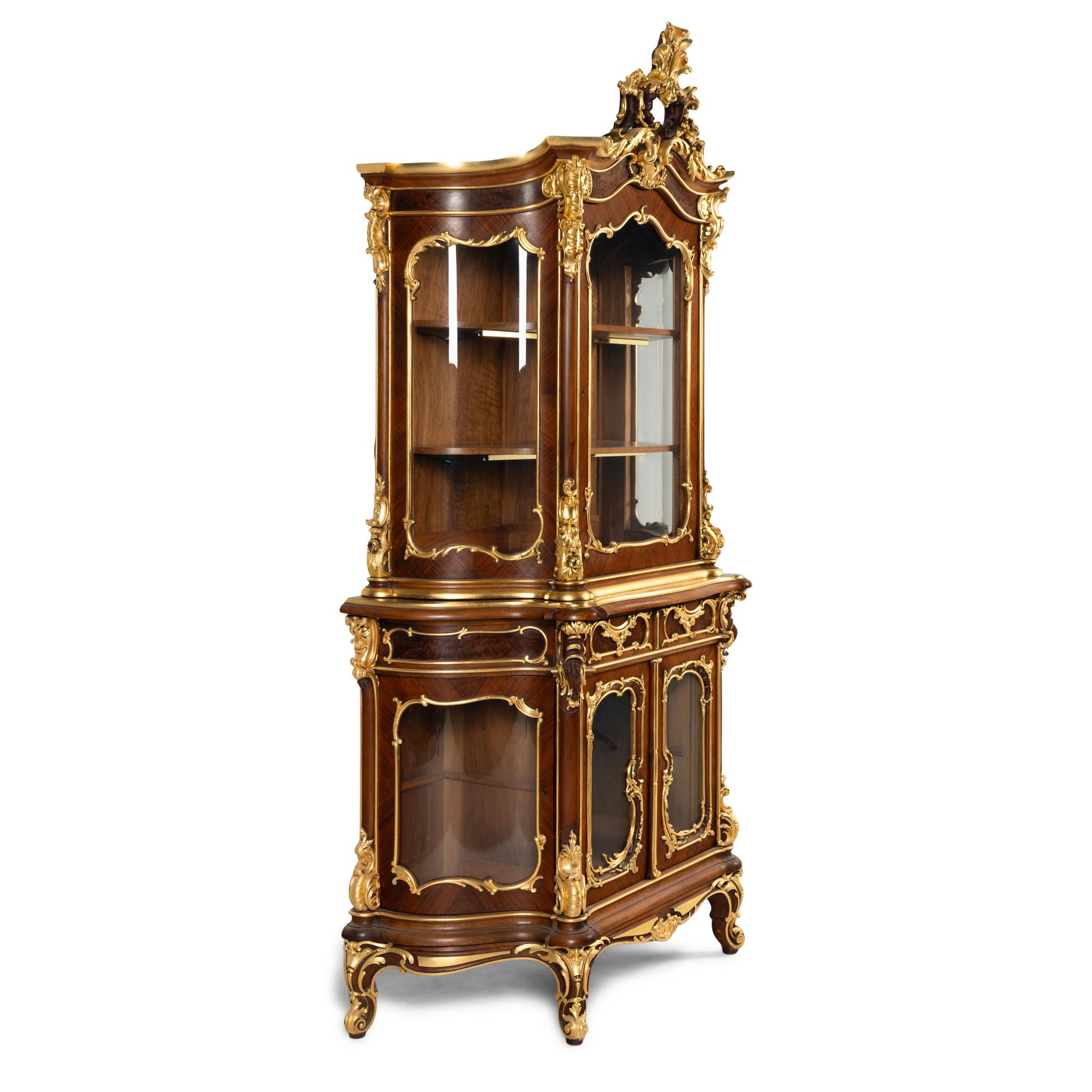 A Louis XV Style Parcel Gilt Mahogany Cabinet à Deux Corps