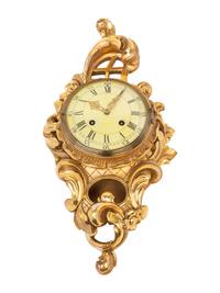 A Rococo Style Giltwood Cartel Clock