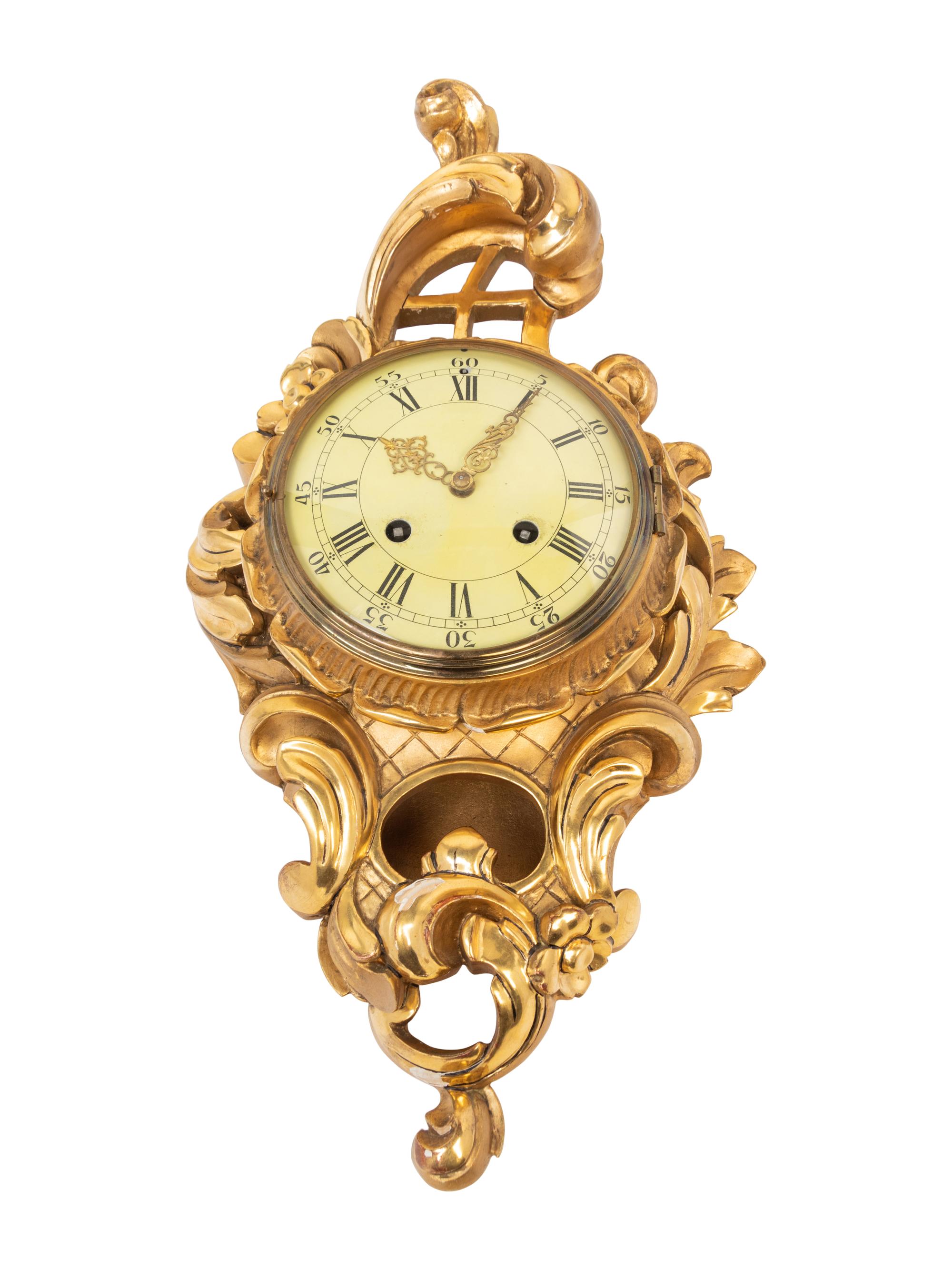 A Rococo Style Giltwood Cartel Clock