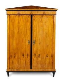 A Biedermeier Parcel Ebonized Walnut Armoire
