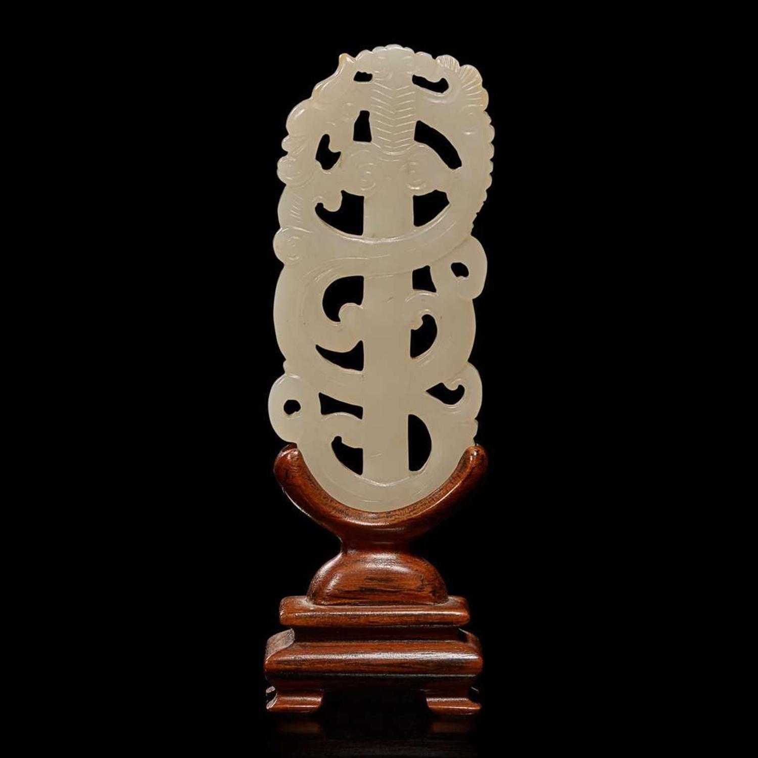 A Chinese white jade "sword" pendant and wood stand 劍形玉飾