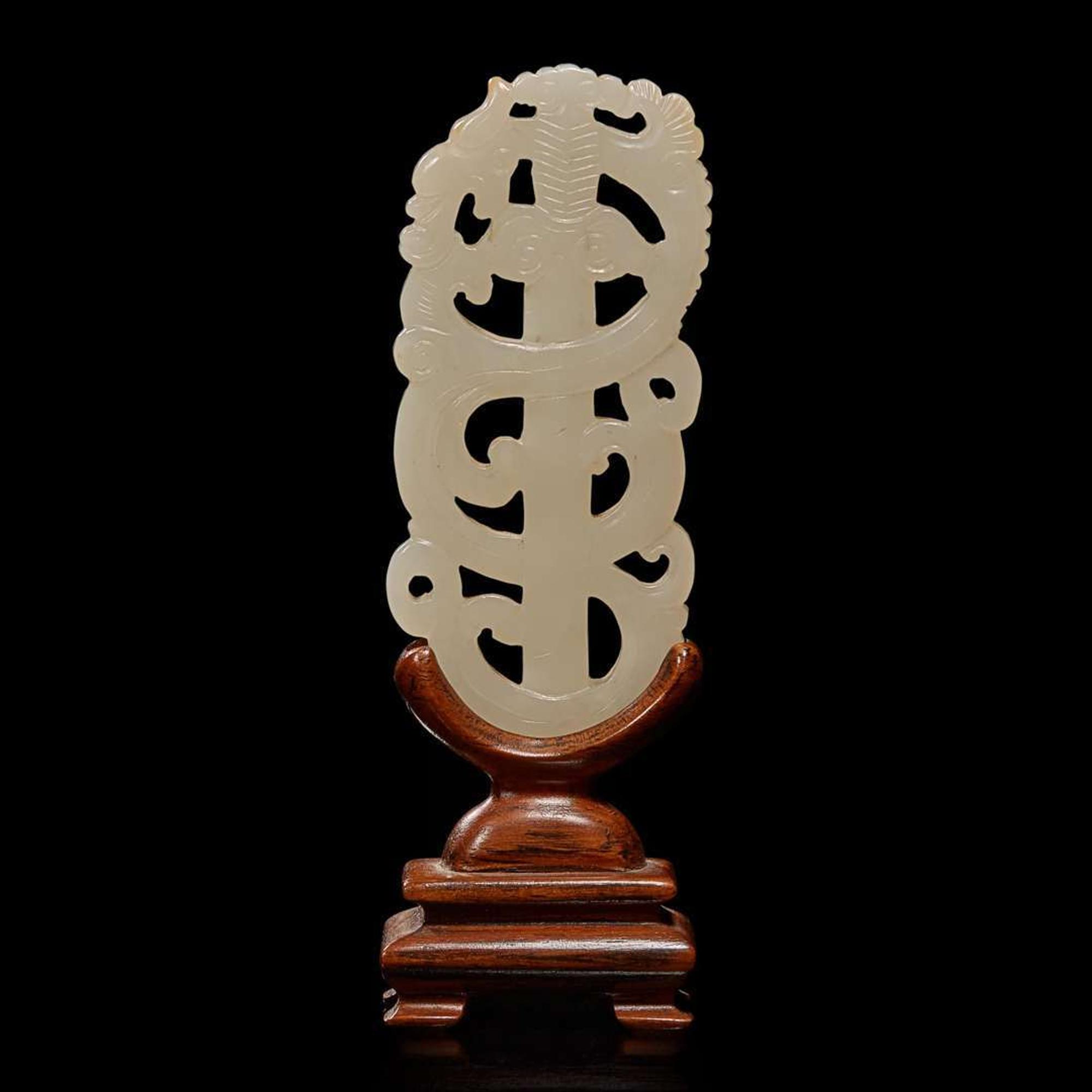A Chinese white jade "sword" pendant and wood stand 劍形玉飾