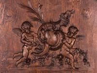A Belgian Louis XV Style Carved Oak Trumeau Mirror