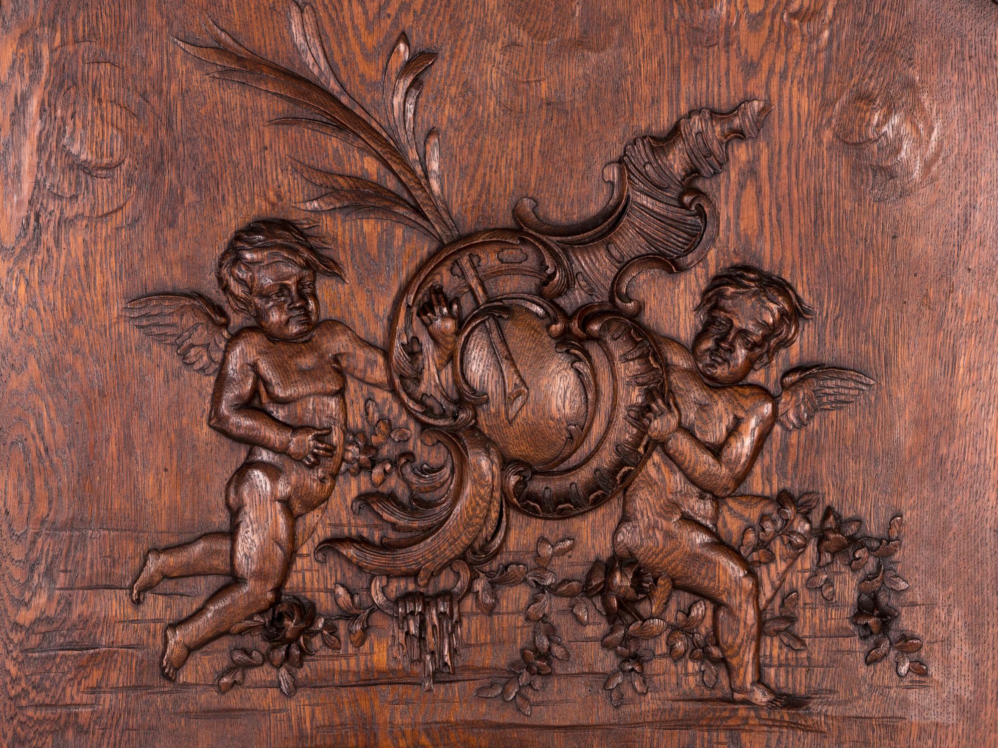 A Belgian Louis XV Style Carved Oak Trumeau Mirror