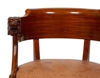 A Regency Style Carved Mahogany Barrel Back Armchair with Lion Head Terminals — 19TH/20TH CENTURY