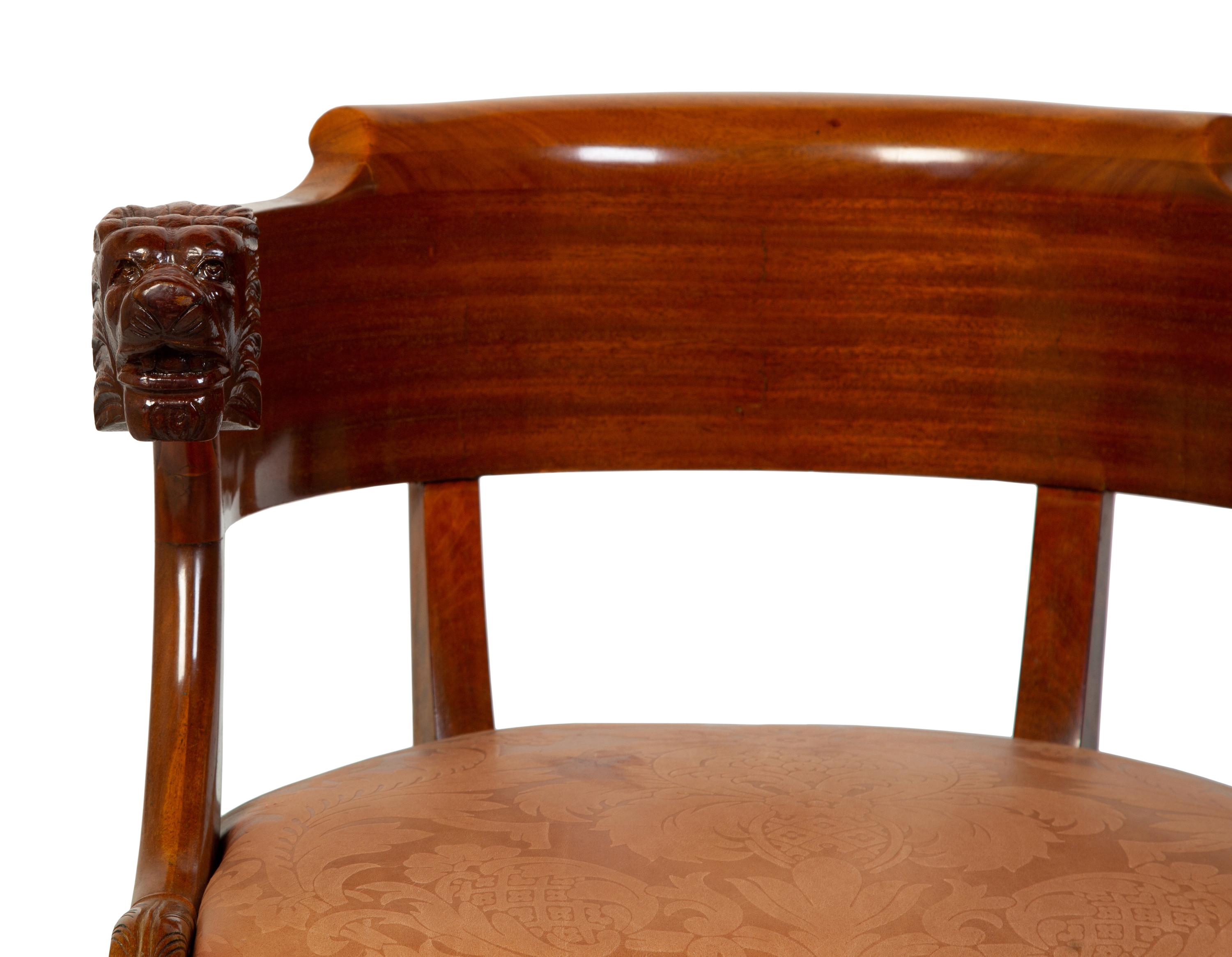 A Regency Style Carved Mahogany Barrel Back Armchair with Lion Head Terminals — 19TH/20TH CENTURY
