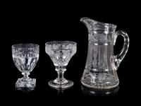 A Collection of Cut and Etched Glass Stemware and a Pitcher