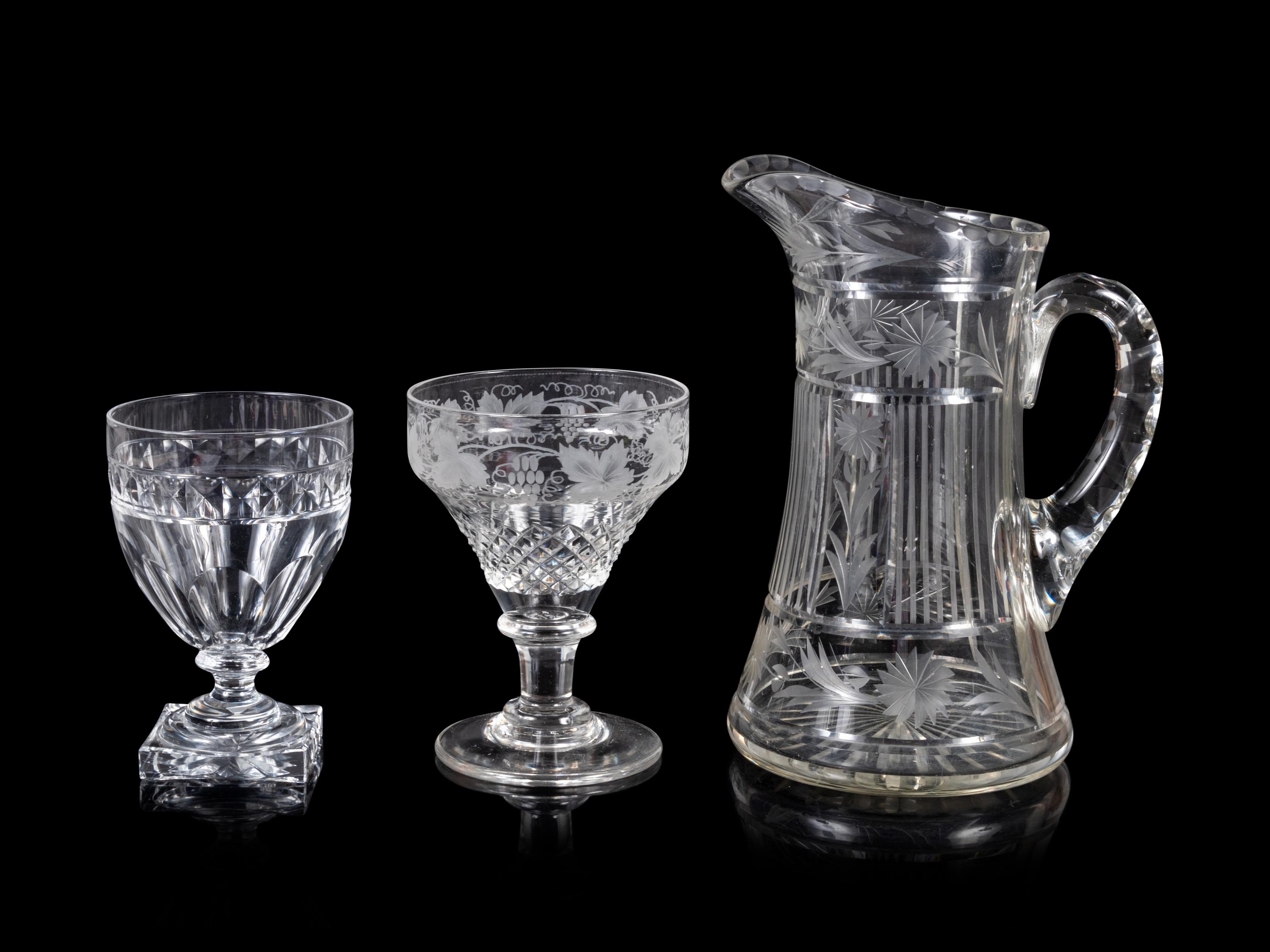 A Collection of Cut and Etched Glass Stemware and a Pitcher