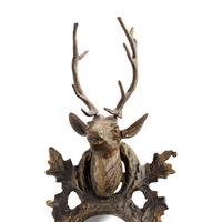 A Gilt and Patinated Bronze Buck Head Mirror