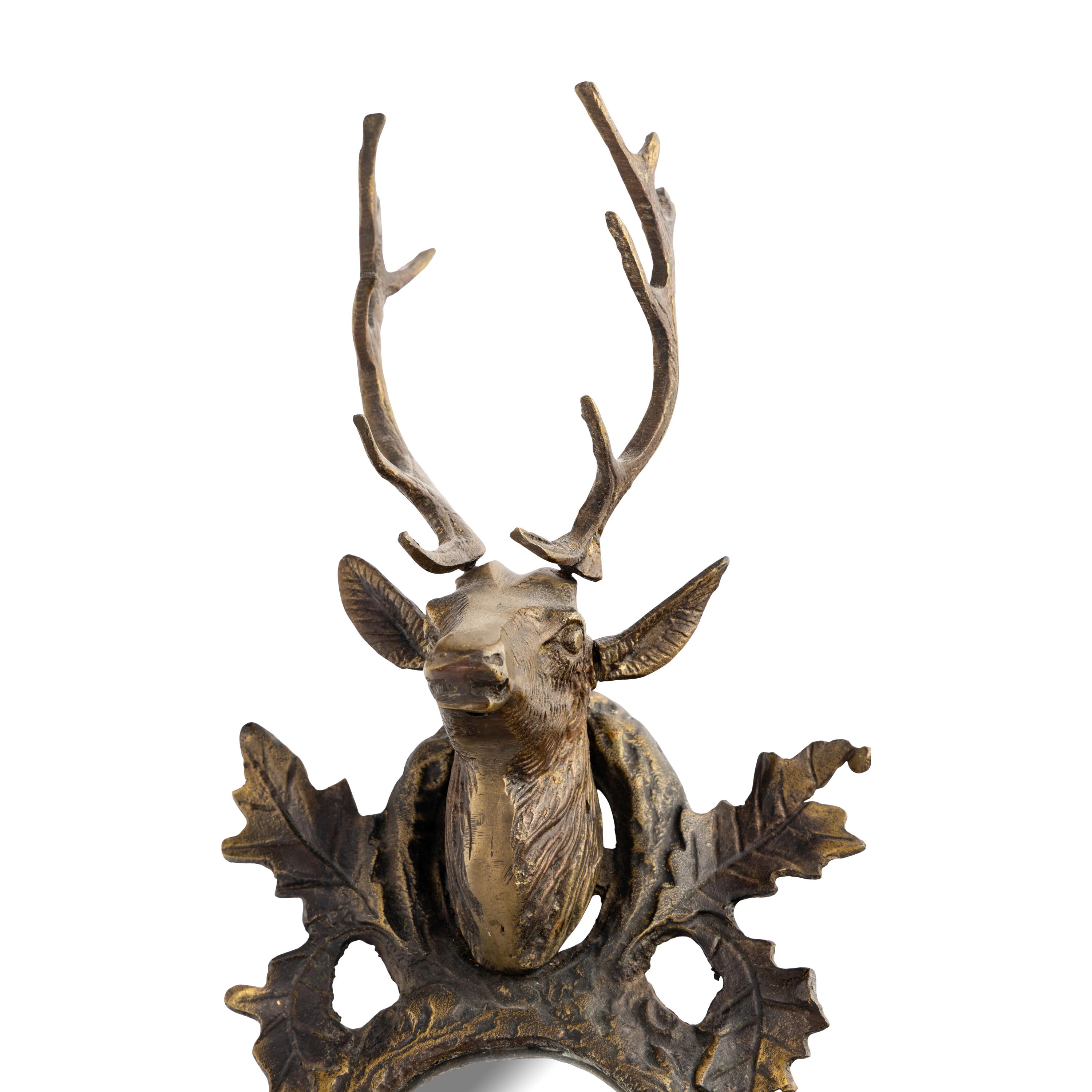 A Gilt and Patinated Bronze Buck Head Mirror
