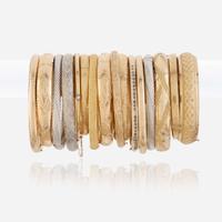 A collection of sixteen fourteen karat gold bangles