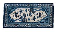 A Kansu Rug 4 feet 11 3/4 inches x 2 feet 7 inches.