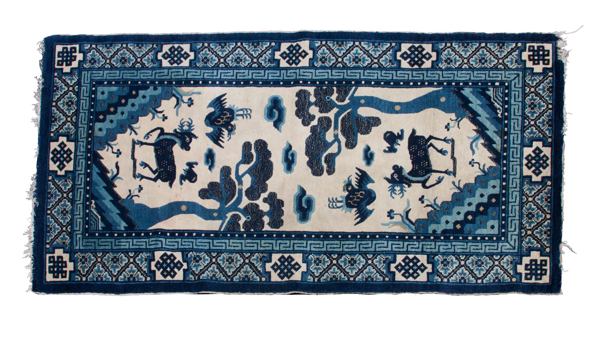 A Kansu Rug 4 feet 11 3/4 inches x 2 feet 7 inches.