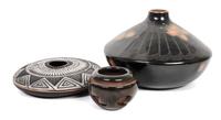 Three Southwestern Pots Height of largest 4 1/2 x diameter 7 1/2 inches.