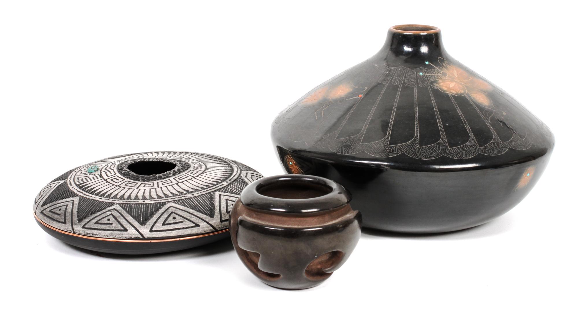 Three Southwestern Pots Height of largest 4 1/2 x diameter 7 1/2 inches.