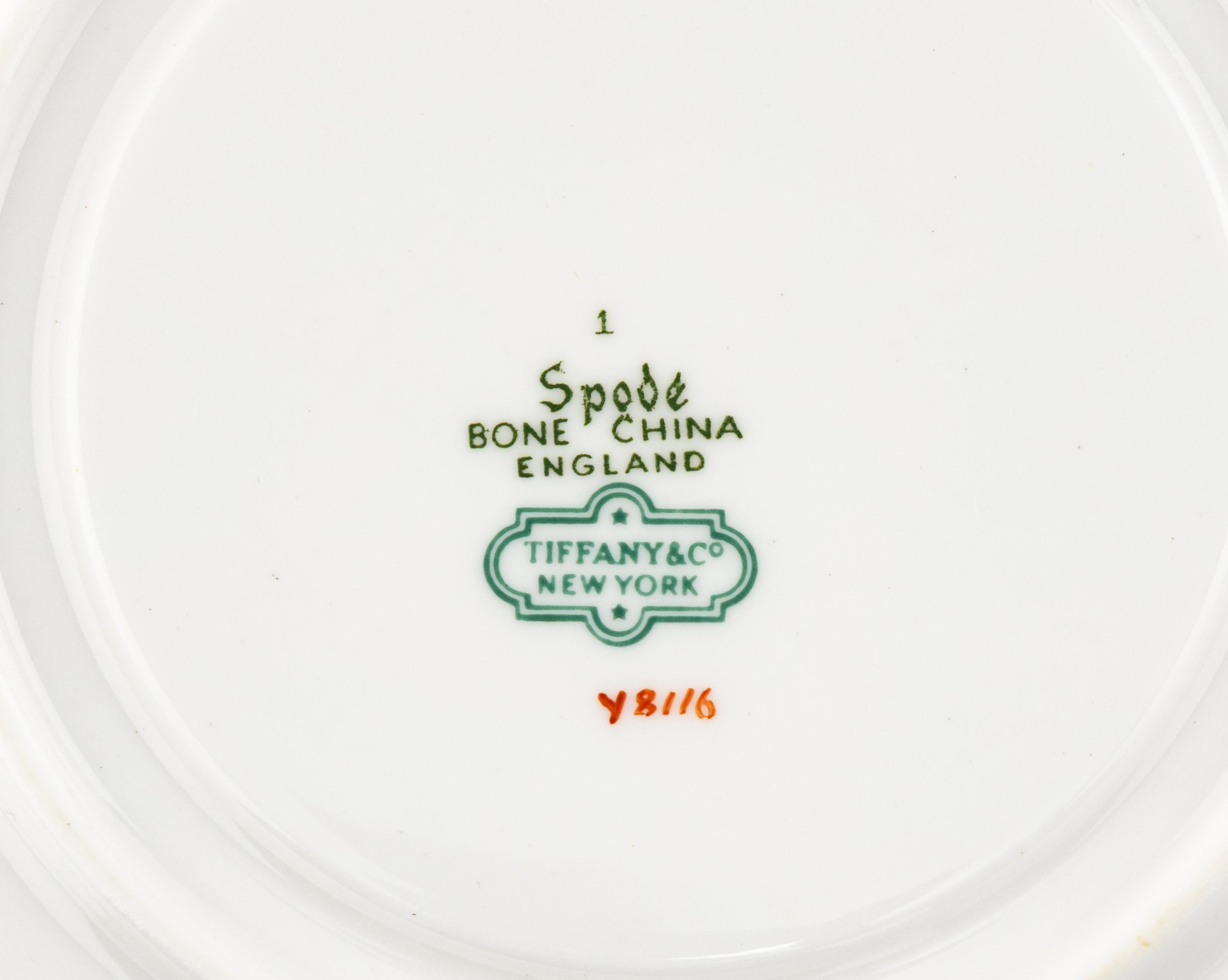 A Spode Porcelain Dinner Service for Fifteen in the Floral Armorial Pattern