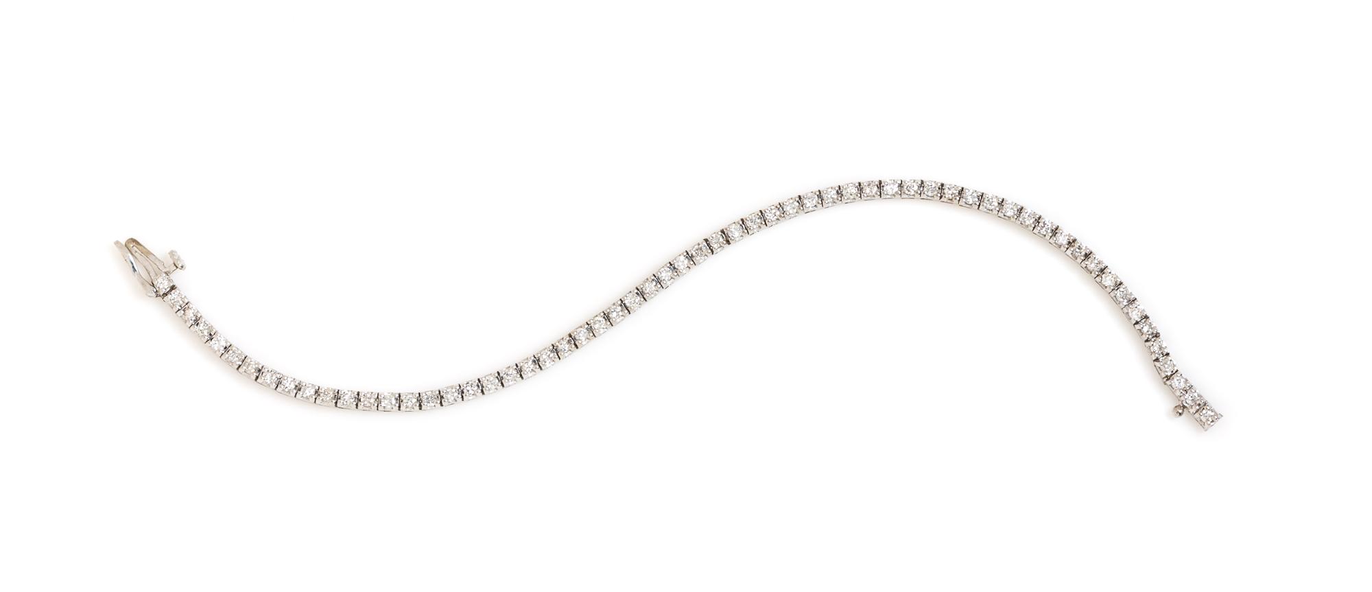 A 14 Karat White Gold and Diamond Line Bracelet, 5.30 dwts.