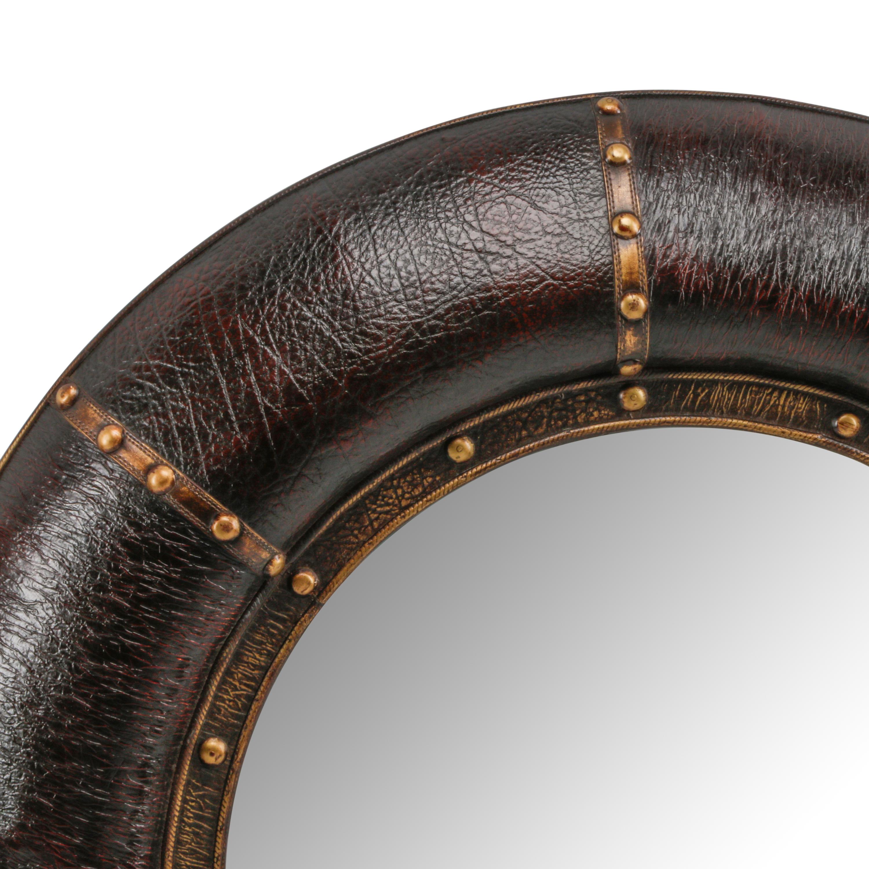 A Pair of Embossed Leather-Framed Mirrors