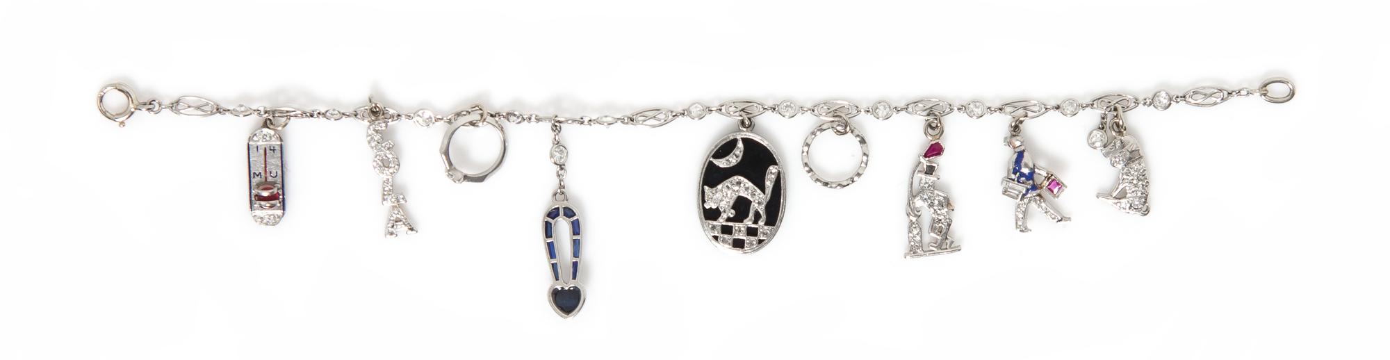 An Art Deco Platinum and Diamond Charm Bracelet, 8.40 dwts.