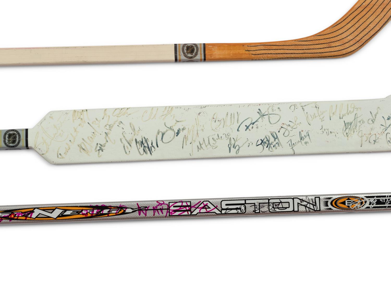 A Group of Chris Chelios Charity Golf Outing Multi Signed Autograph Hockey Sticks