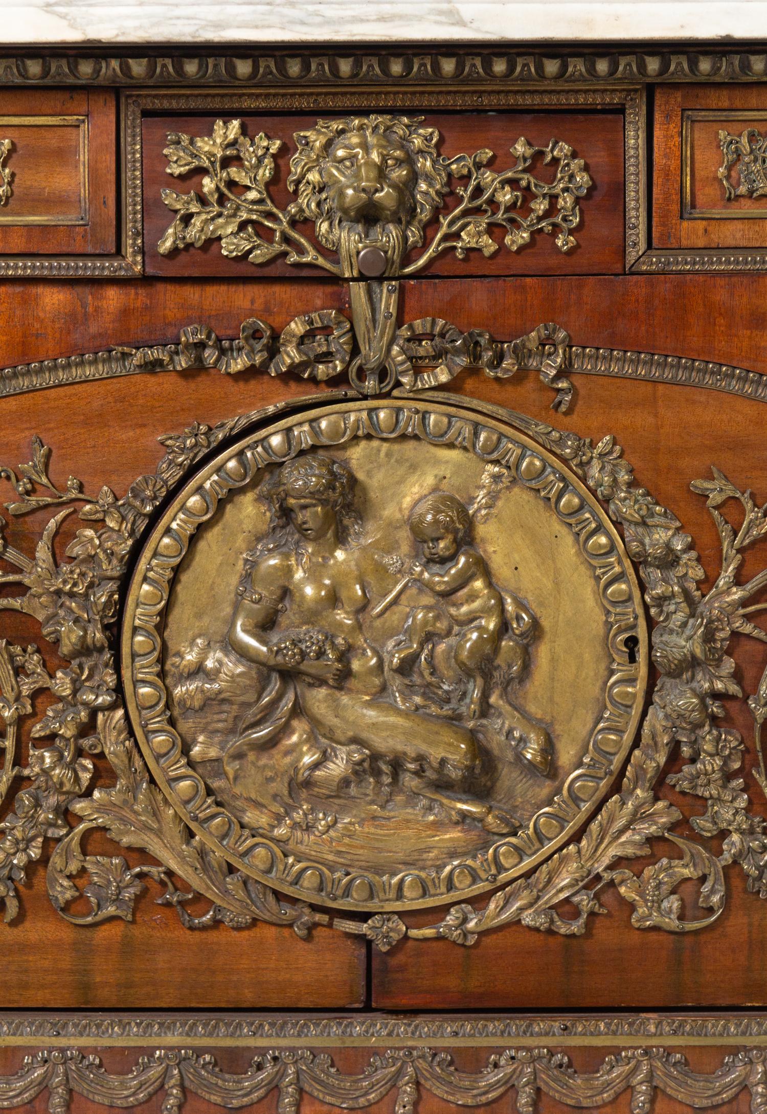 A Louis XVI Style Gilt Bronze Mounted Mahogany Marble-Top Commode à Vantaux