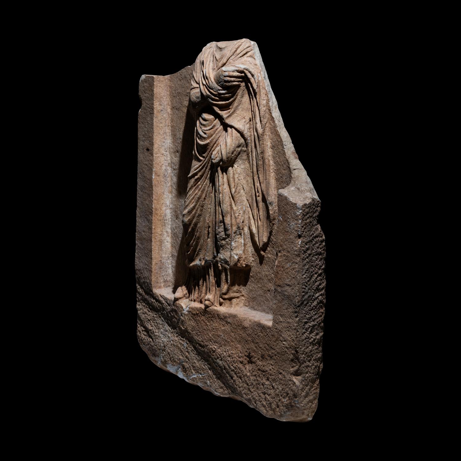 A Roman Marble Funerary Relief Fragment