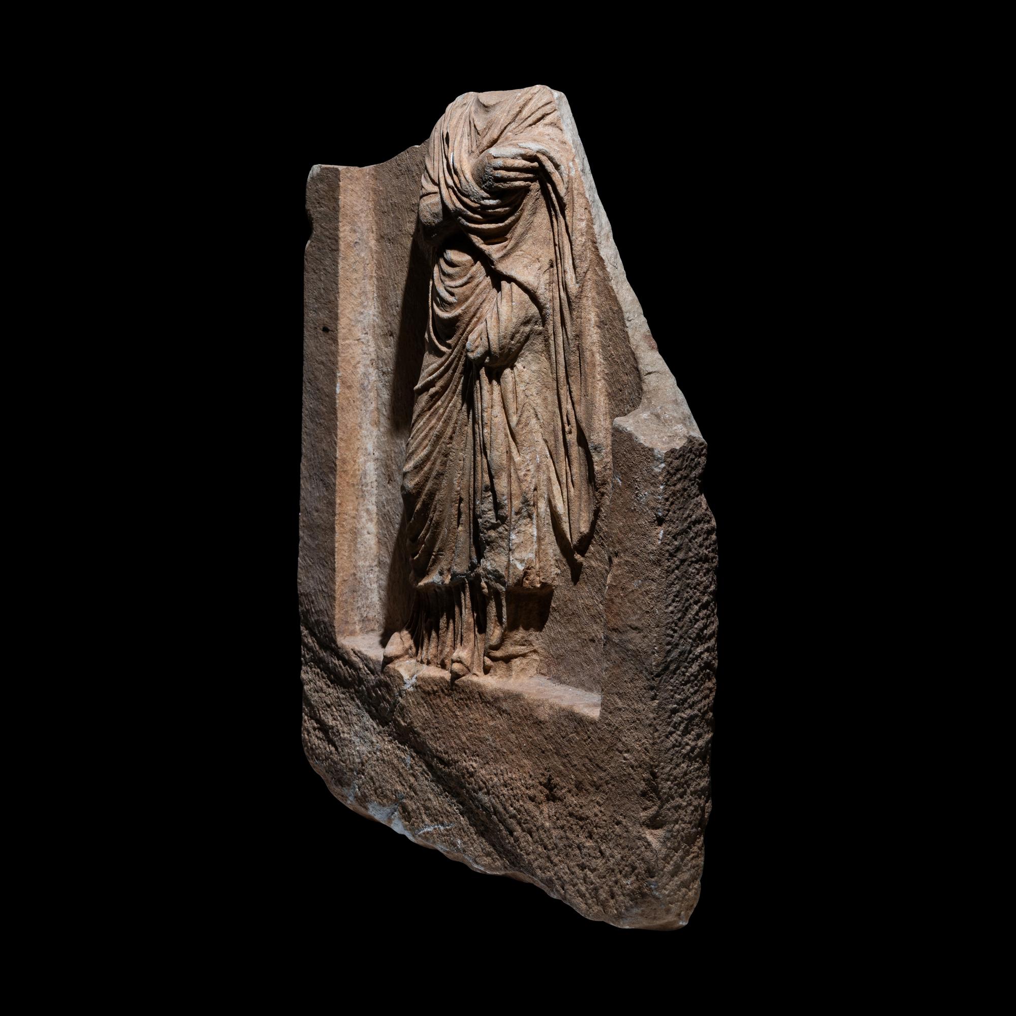 A Roman Marble Funerary Relief Fragment