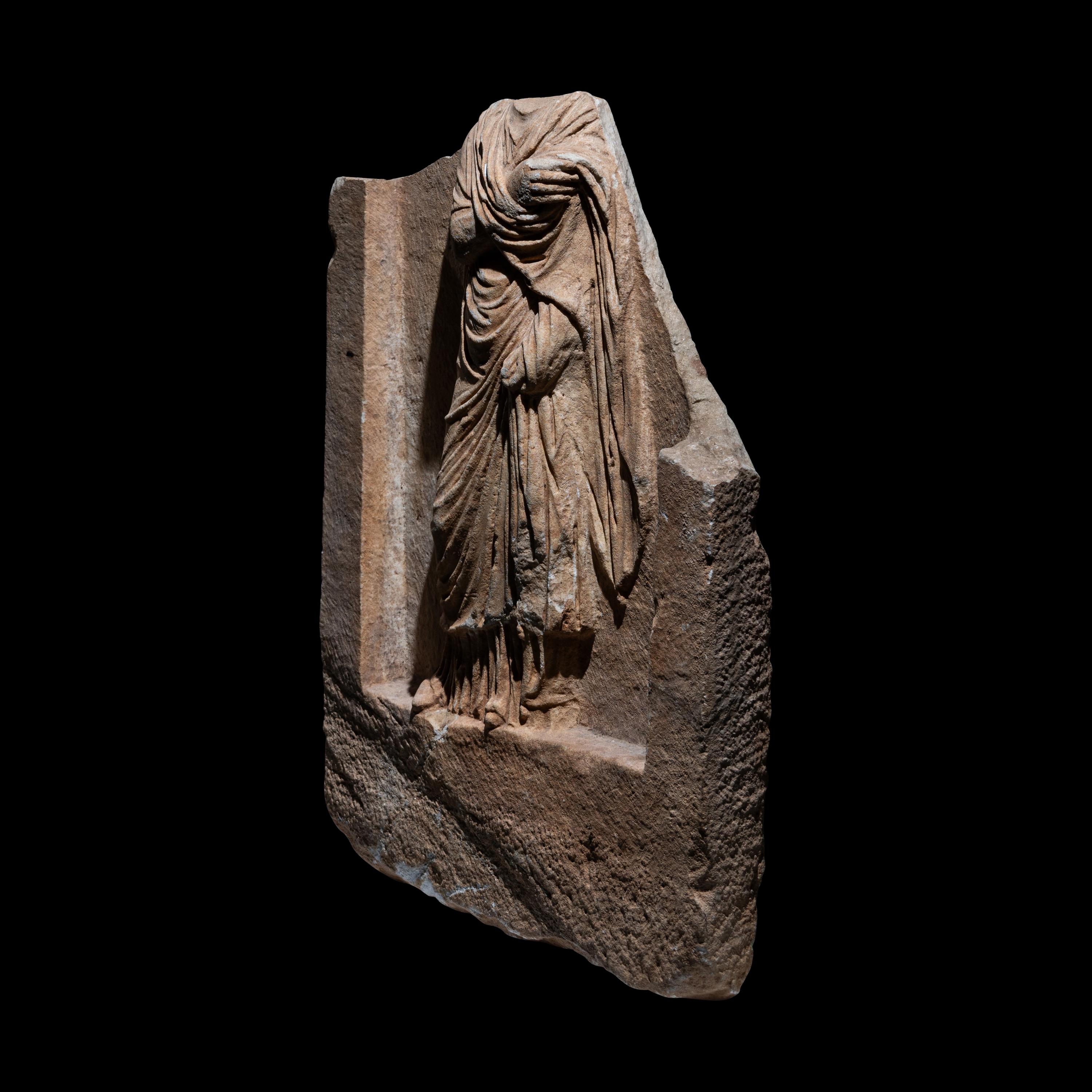 A Roman Marble Funerary Relief Fragment