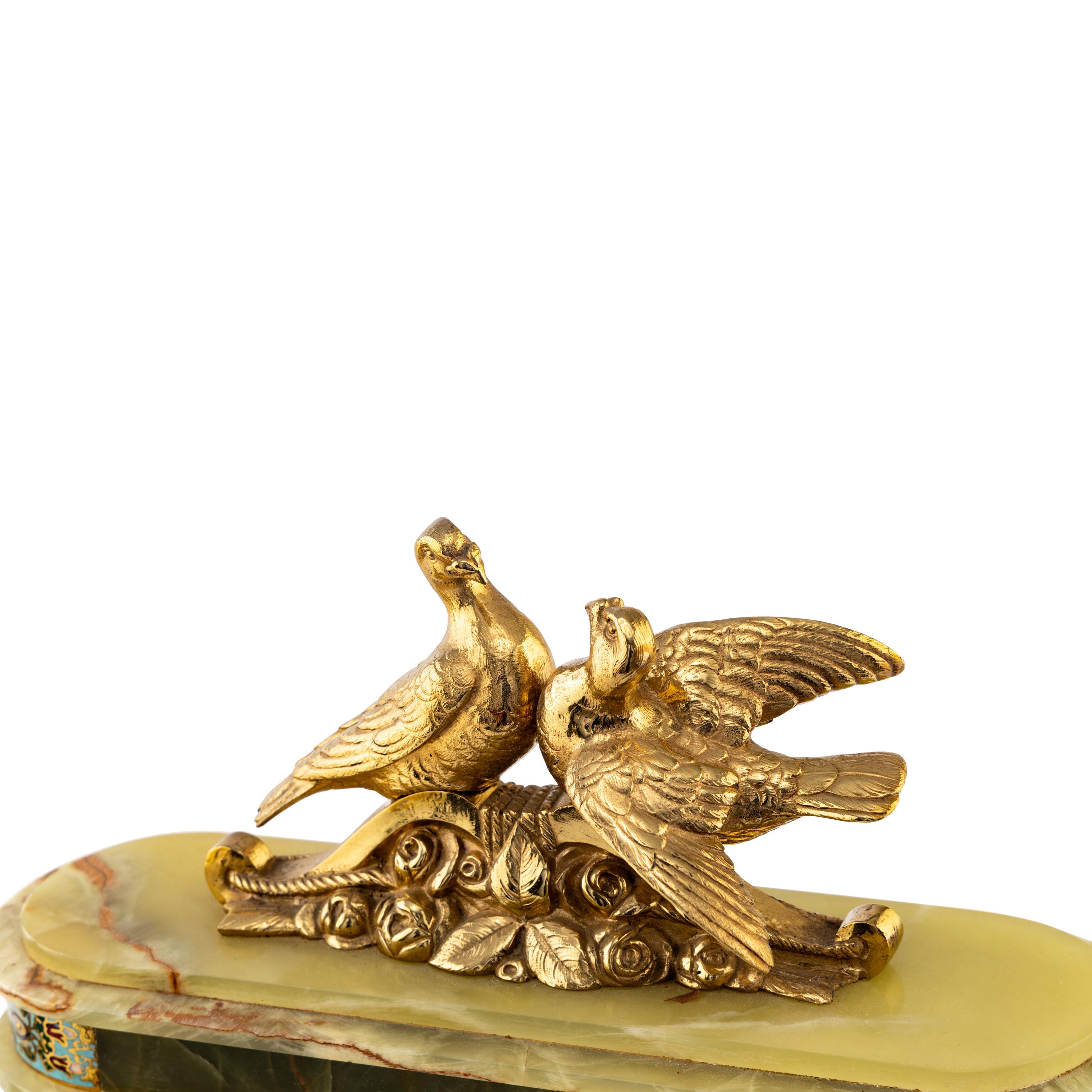 A French Green Onyx, Gilt-Metal and Champlevé Three-Piece Clock Garniture